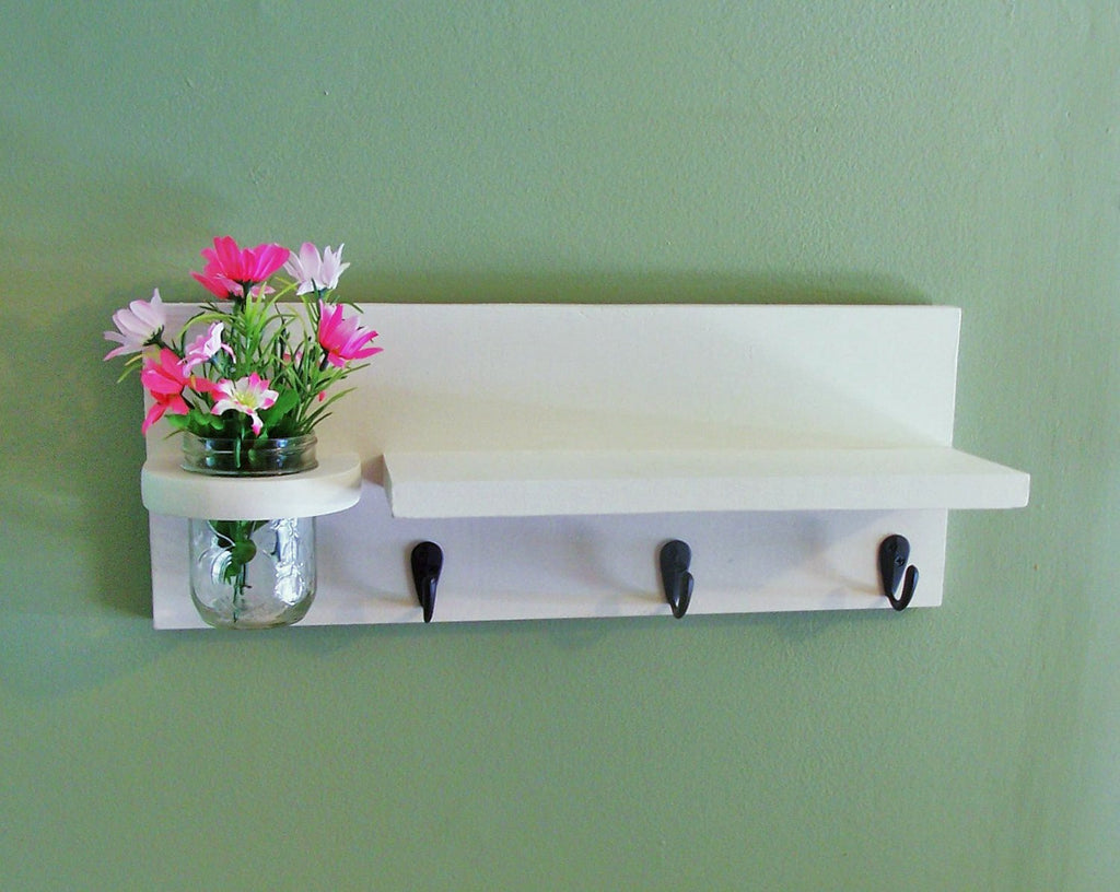 Shelf with mason jar and key hooks and jar